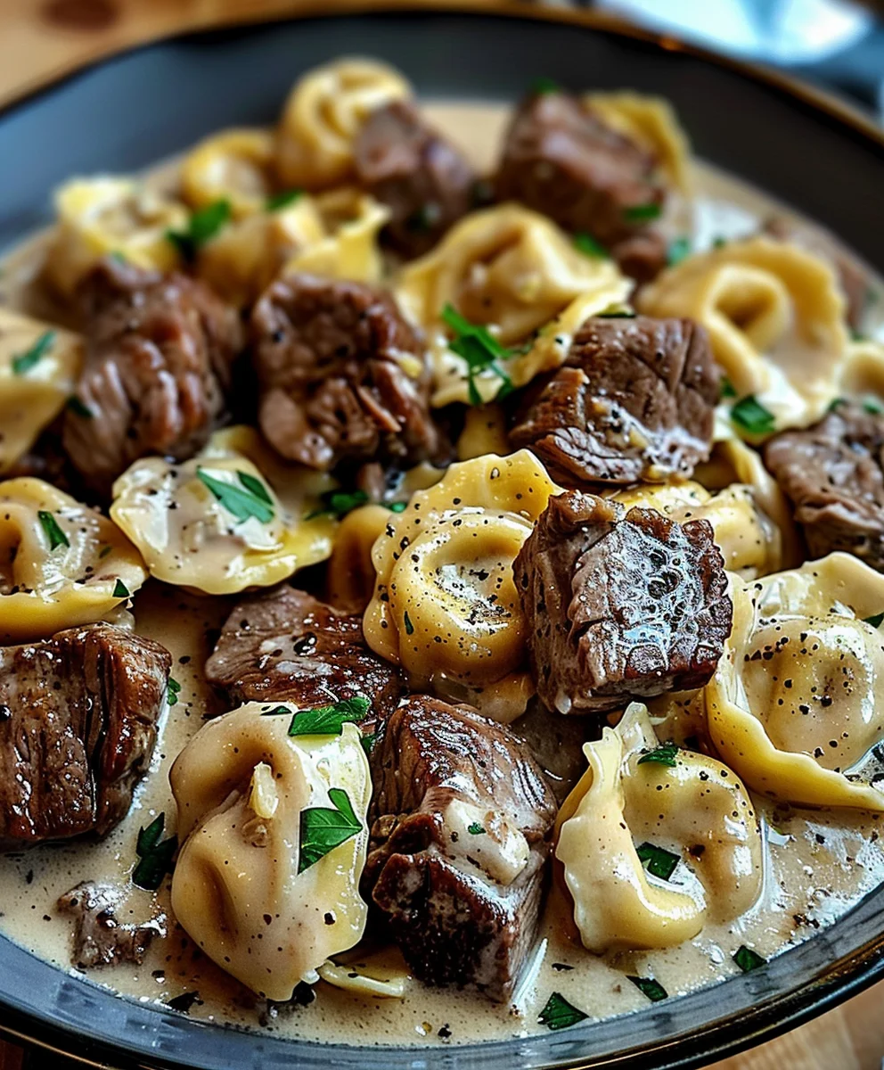Irresistible Cracked Garlic Steak Tortellini in Cream Sauce