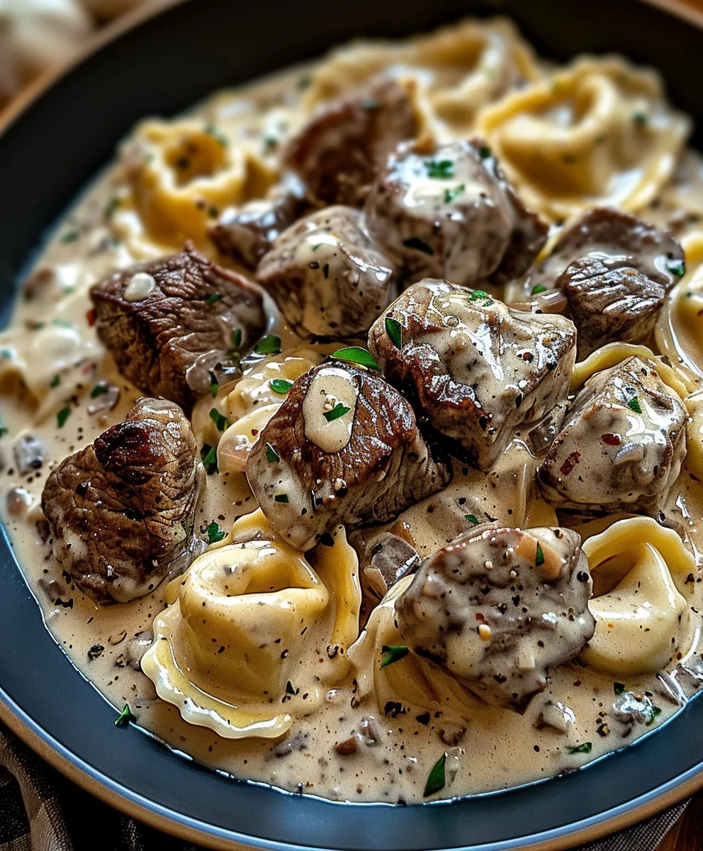 Irresistible Cracked Garlic Steak Tortellini in Cream Sauce